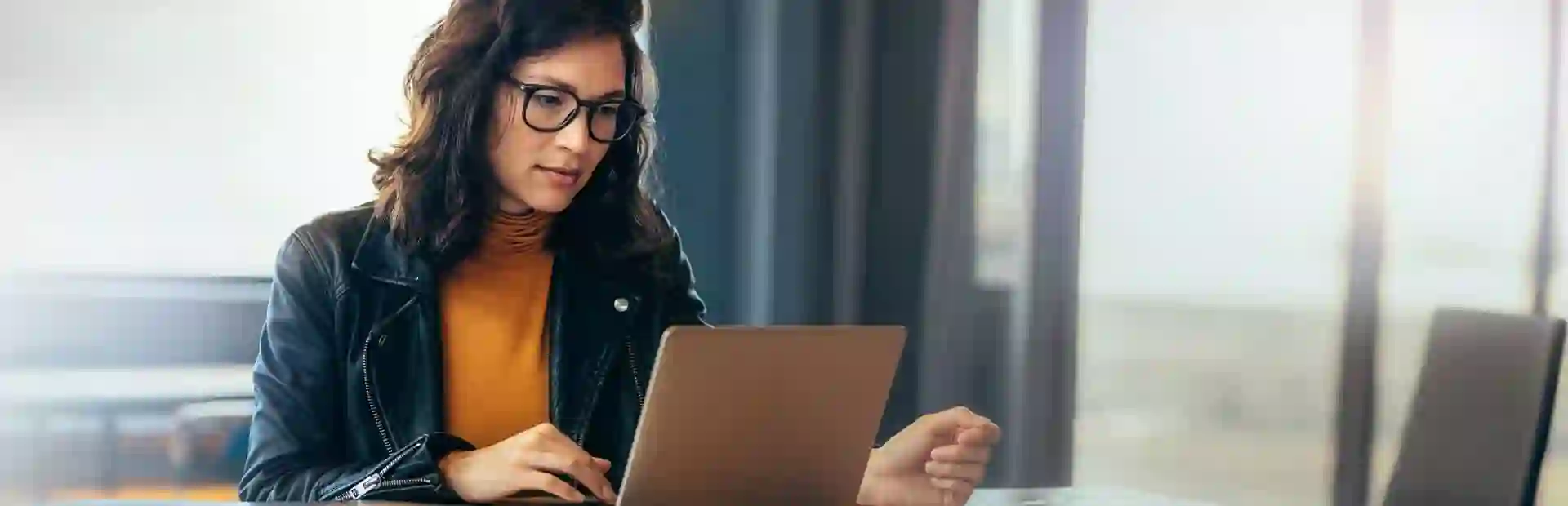 Woman working from home, representing TP’s Cloud Campus winning gold as Best Work-at-Home solution.