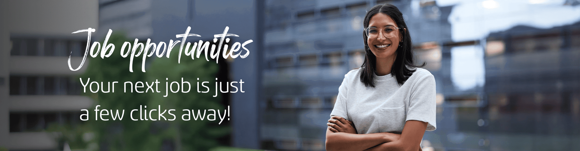 a person smiling with arms crossed stands in front of a blurred office building. bold text reads: "job opportunities. your next job is just a few clicks away!