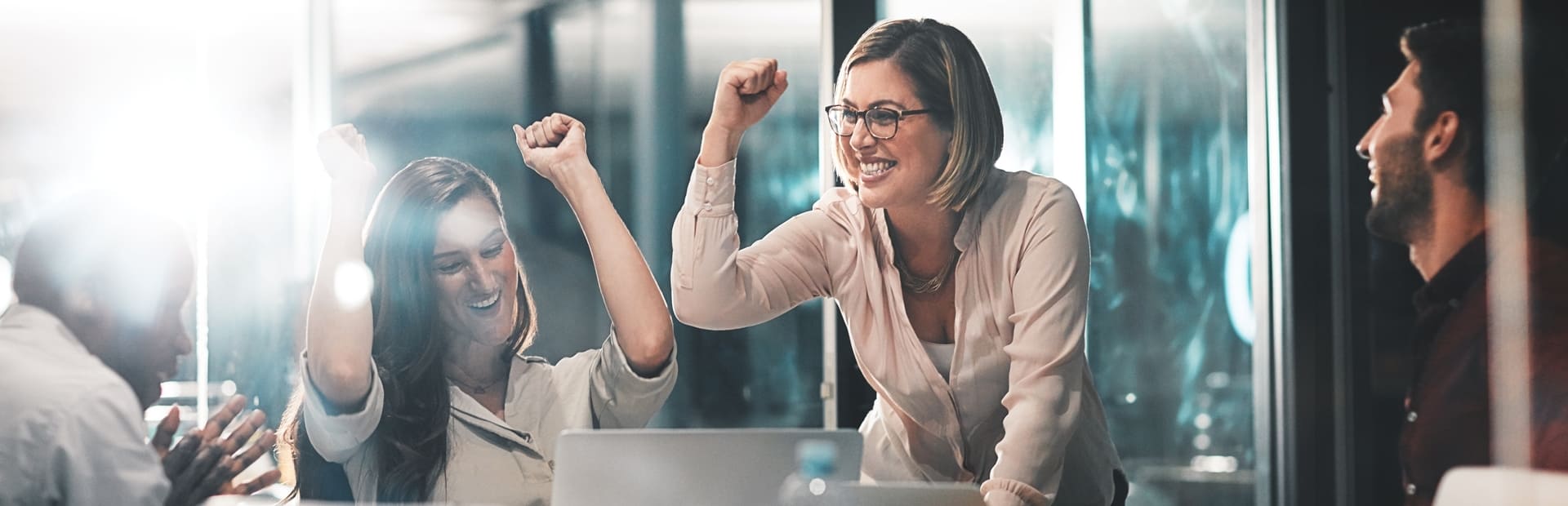 Business team celebrating a collective achievement, reflecting collaboration and success.