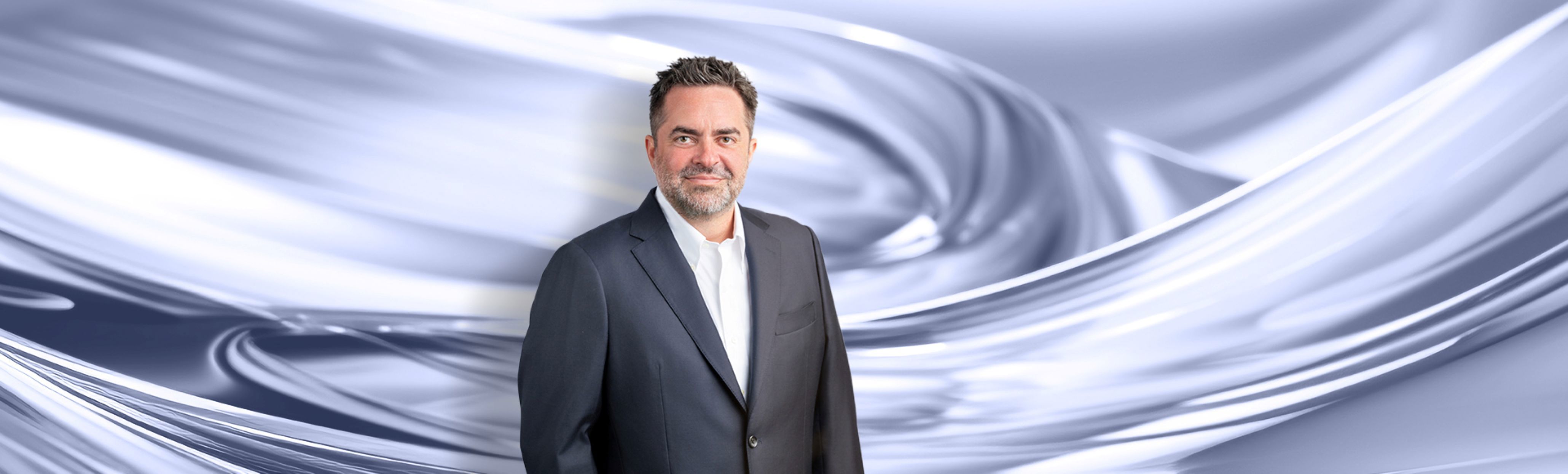 A man with dark color suit