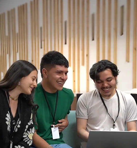 TP employees smiling together in the office, showing team spirit and belonging.