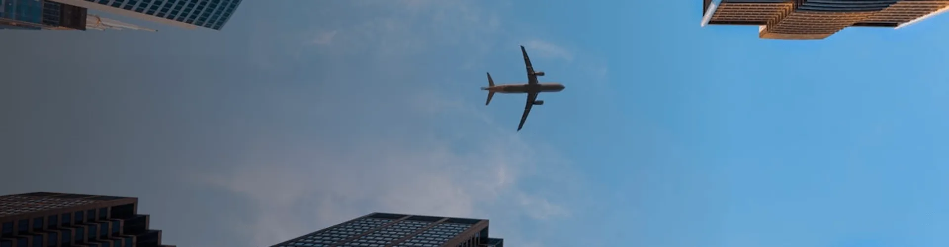 Airplane flying over the city