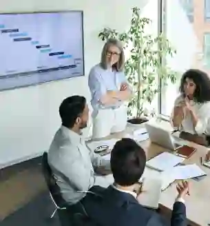 Group of employees having a meeting to discuss team strategies