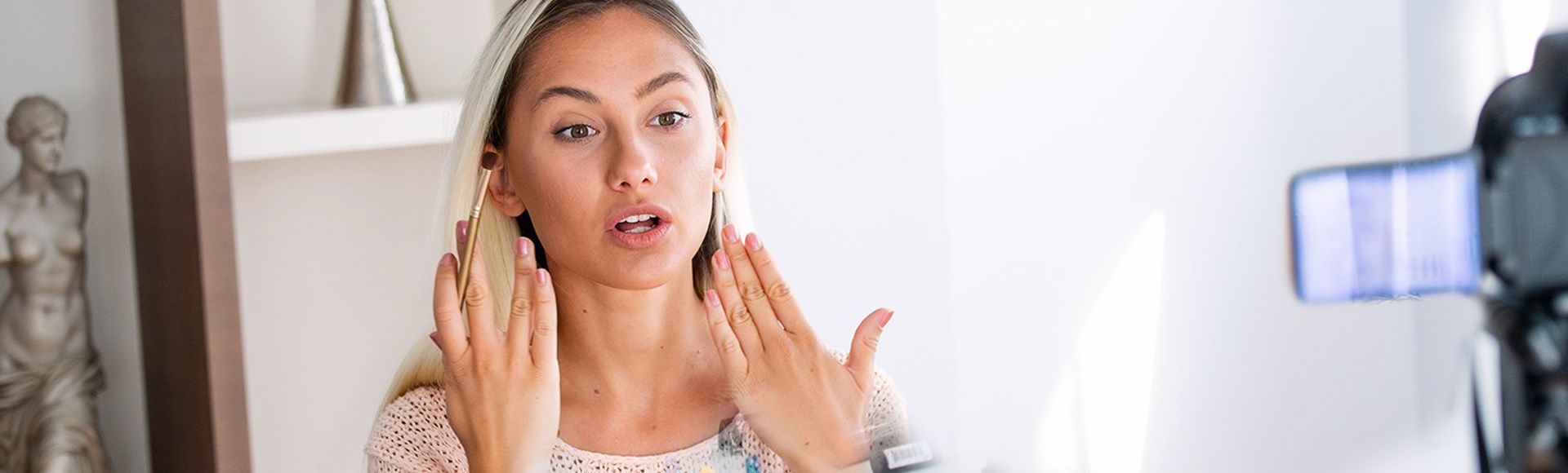 Woman applying lipstick