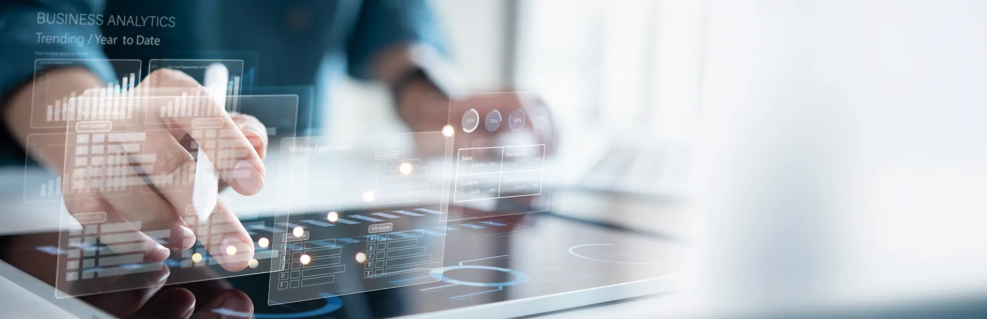 Analytics professional reviewing data insights on a high tech display.