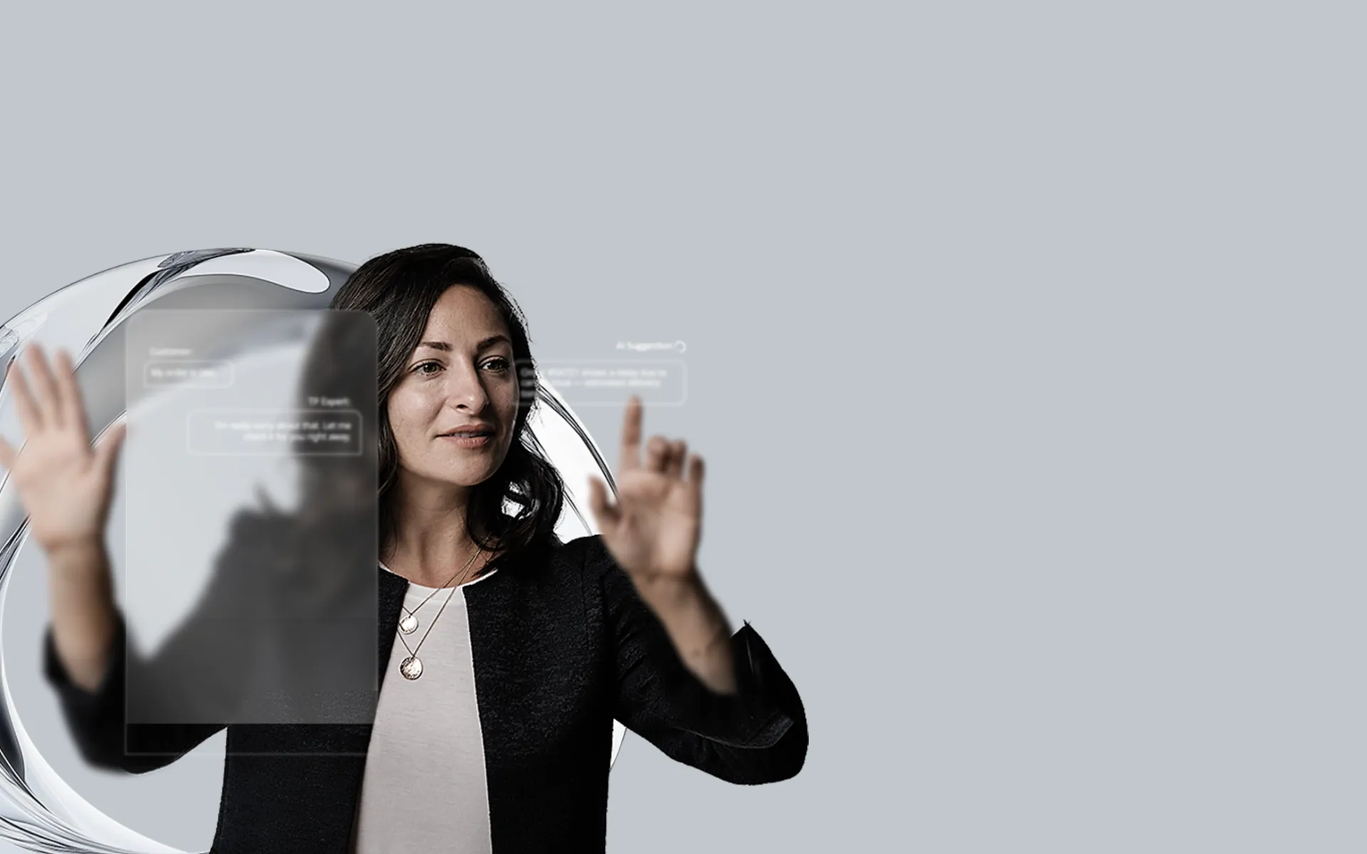 Woman interacting with a 3D chatbot panel through touch.