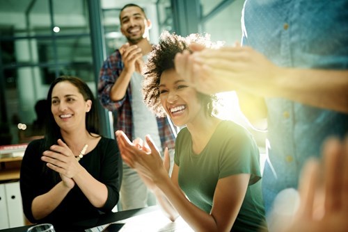 Office workers applauding