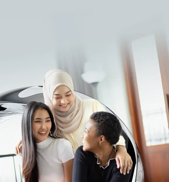 Three colleagues smiling together, highlighting job opportunities at TP.