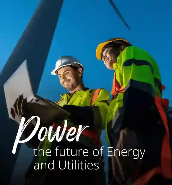 Wind power tower operators working on computer