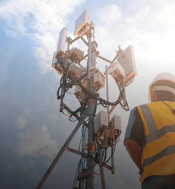 Man working on a transmission tower