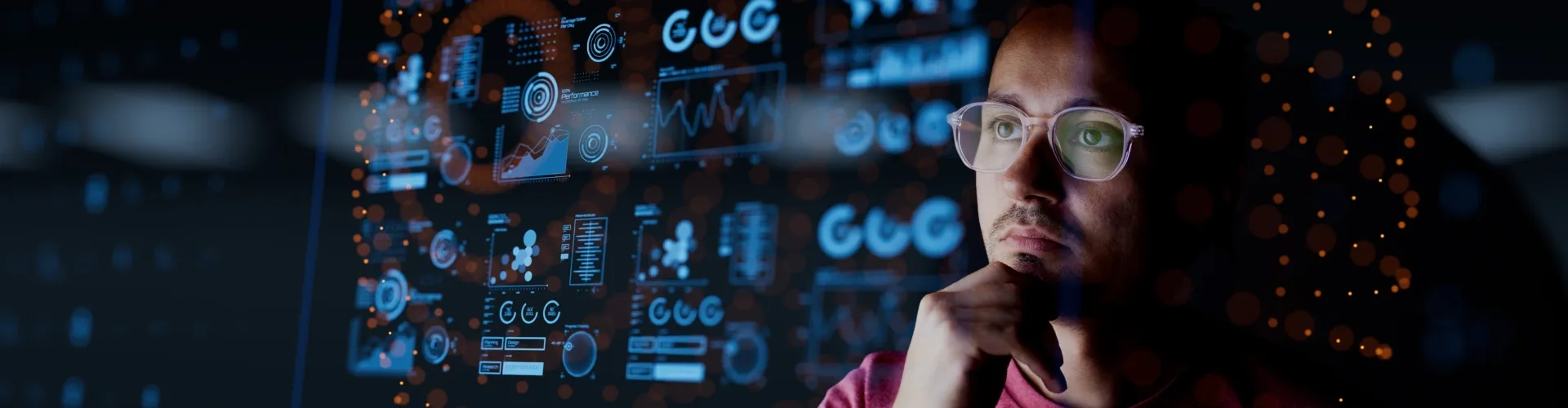 Person analyzing AI data dashboards on a screen, reflecting TP’s focus on data-driven innovation.