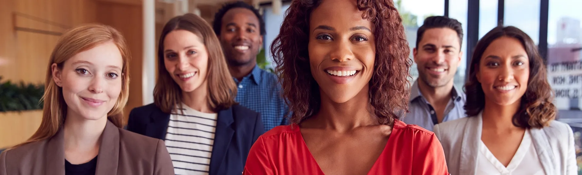 Staff member smiling at camera in an office