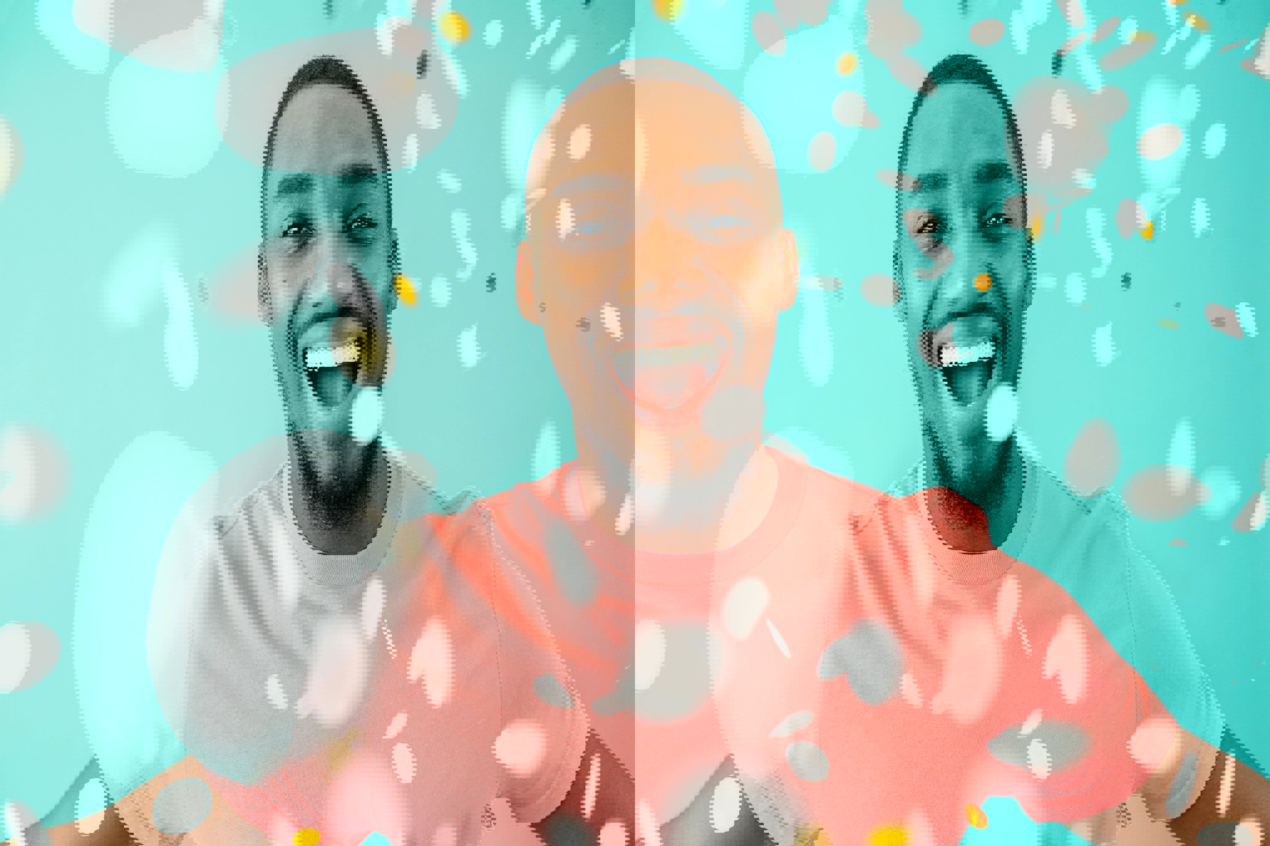 Smiling man in a pink shirt celebrating with falling confetti on a turquoise background