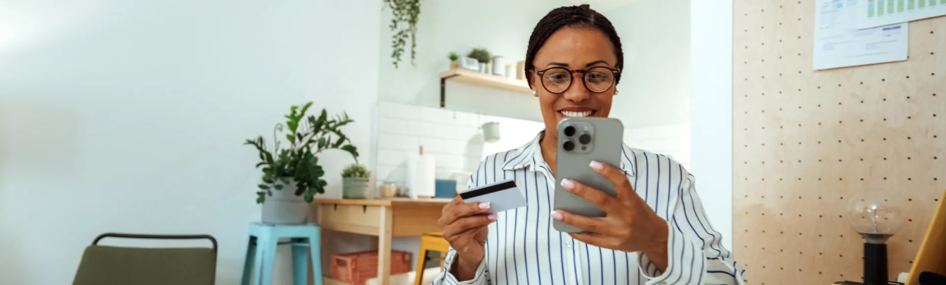 Woman managing her banking needs conveniently from home using a smartphone.