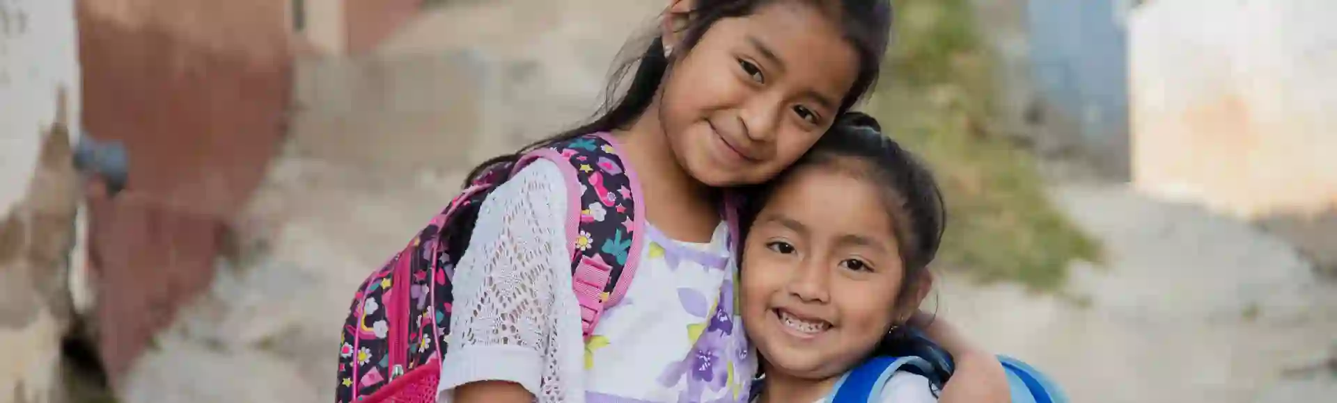 Young girls hugging each other