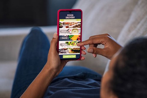 Person browsing a food delivery app