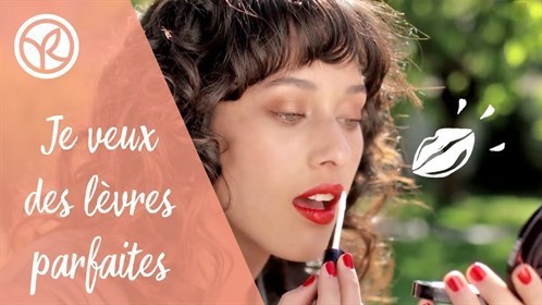 Woman applying lipstick