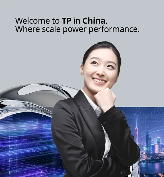 A woman rested her chin in her hand and smiled, looking upwards, dressed in a suit.