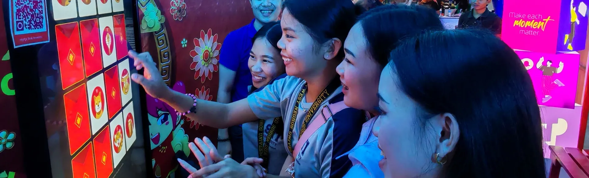Girls interacting with a Chinese zodiac matching puzzle.