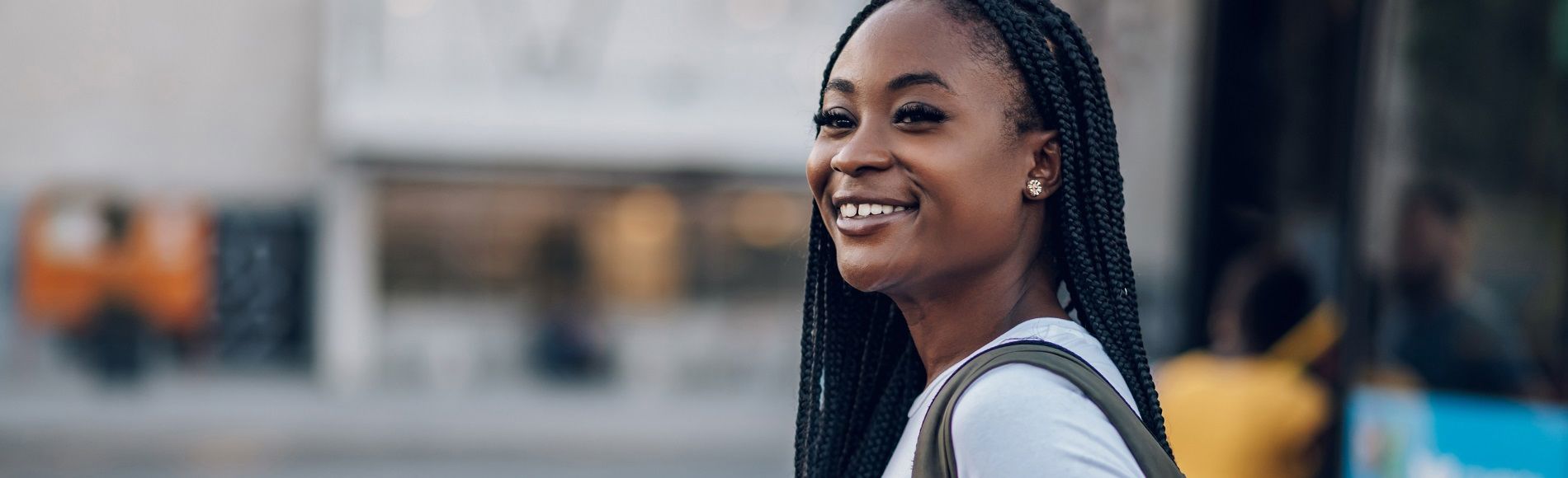 African woman looking ahead, symbolizing hope. Image for blog on "Pad Me" in Ghana, tackling barriers to girls’ education.