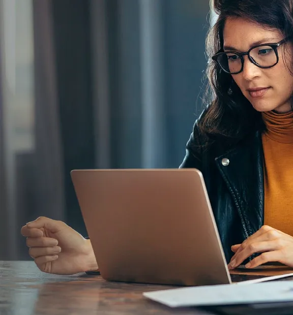 Serious woman working on computer