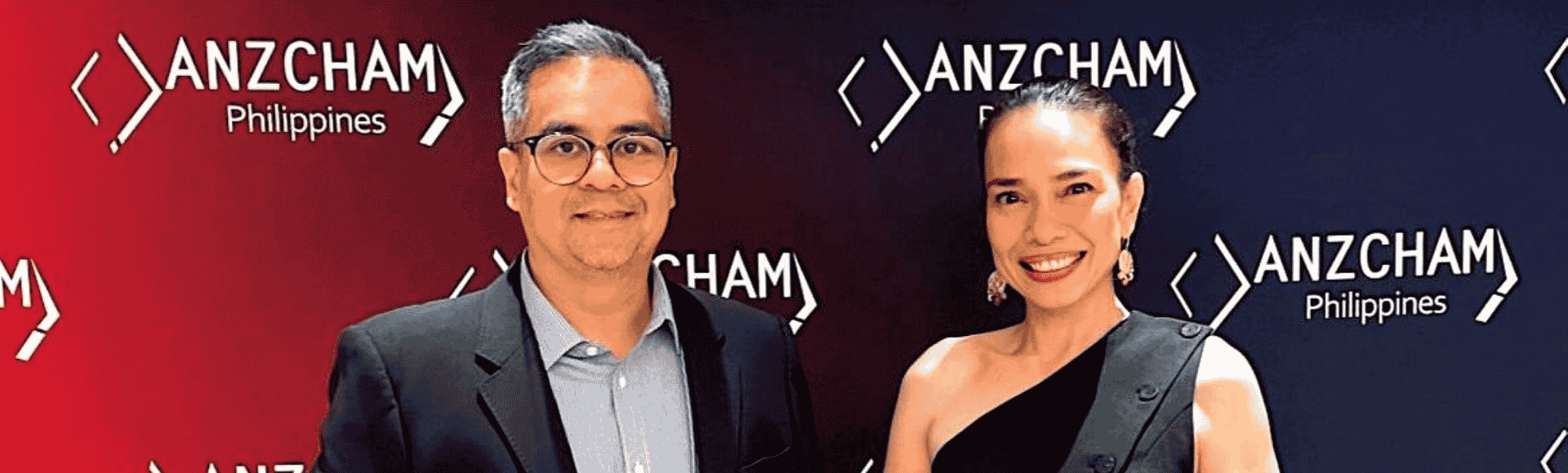Two TP leaders holding one award each from the Australian-New Zealand Chamber of Commerce Philippines (ANZCHAM)