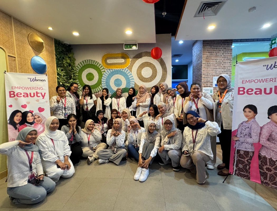 A group of women gather for the "Empowering Beauty" TP Women event.
