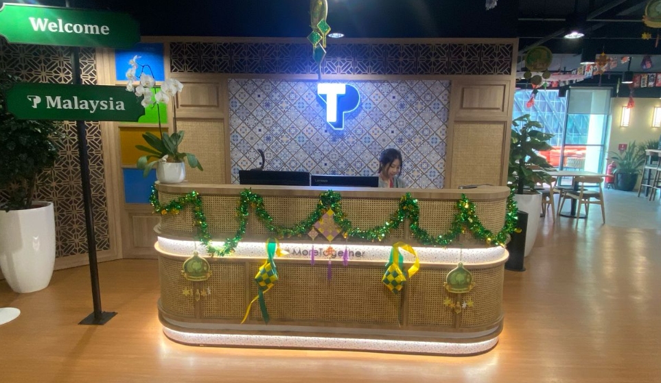 TP Malaysia reception desk decorated for festive celebration