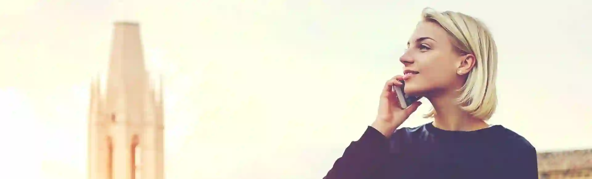 Blonde woman talking on the phone.