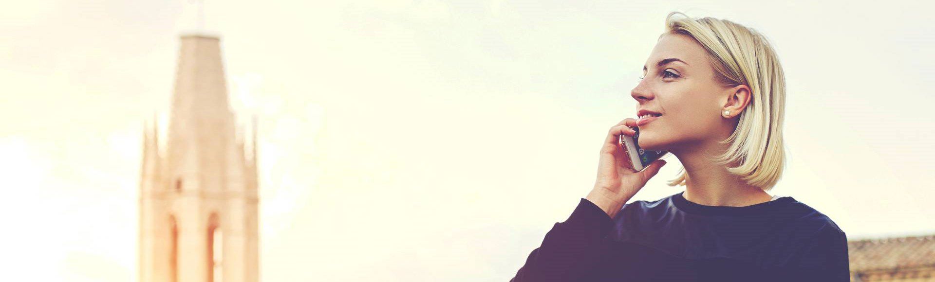 Blonde woman talking on the phone.