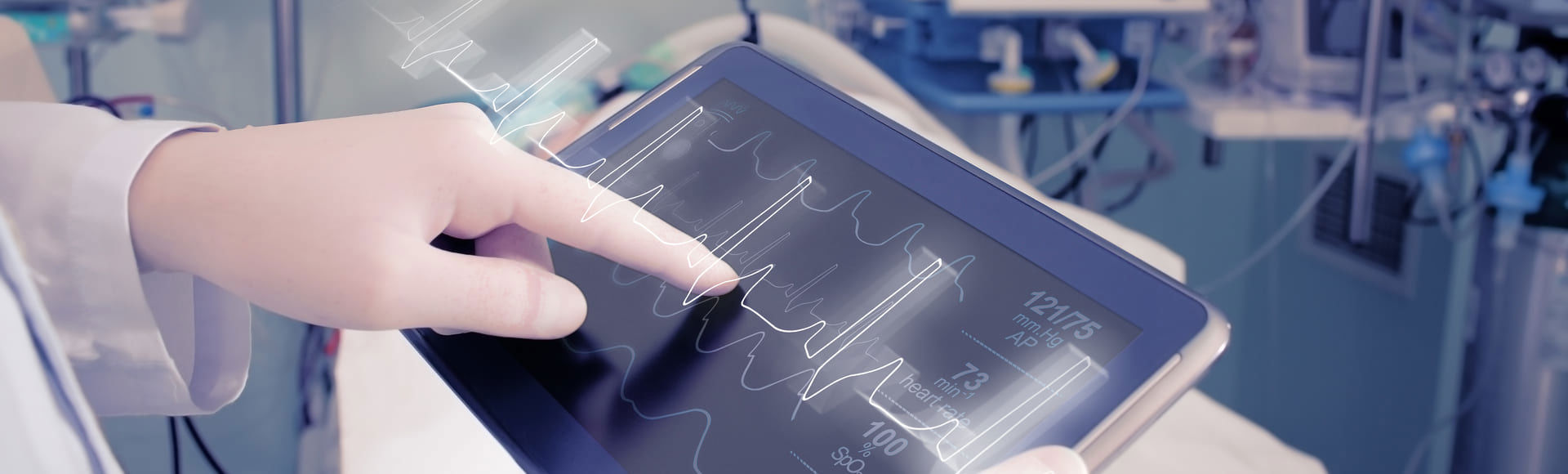 Gloved hands of a healthcare professional operating a medical device.