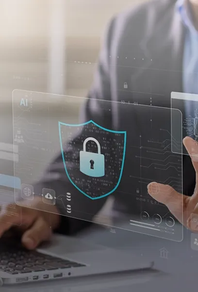 Digital security shield interface displayed over a laptop workspace.
