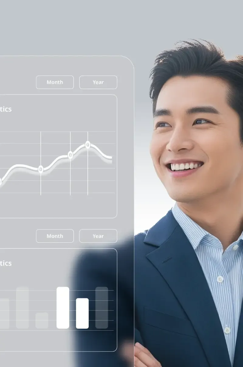 A short-haired man in a suit smiles, arms crossed.