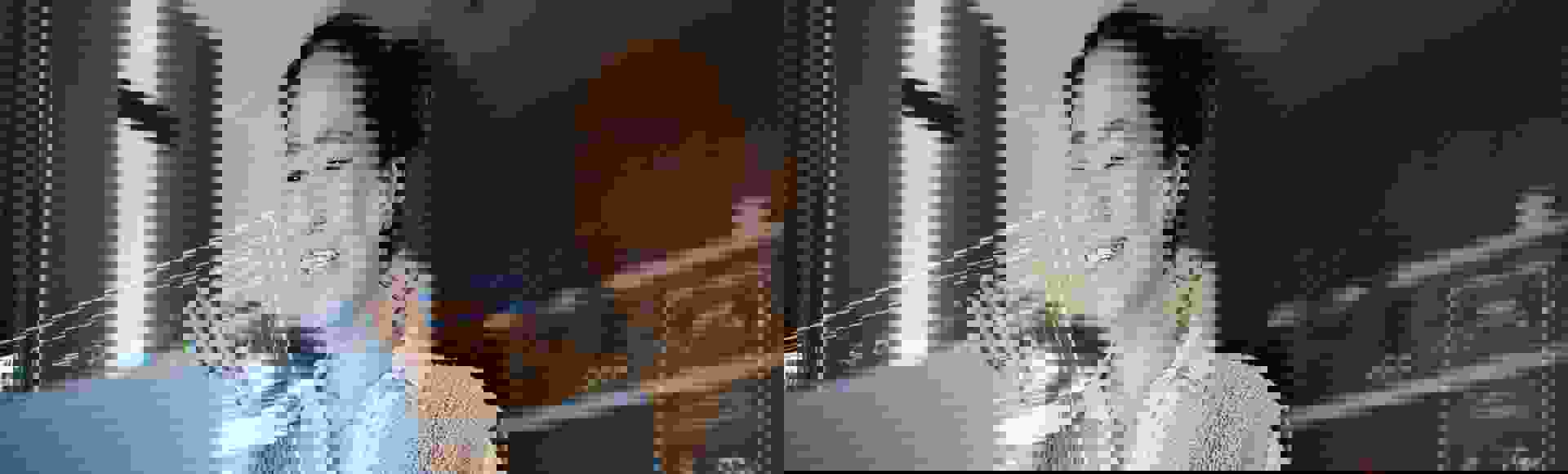 Asian woman working on a computer, interacting with futuristic 3D elements emerging from the screen, representing Human CX innovation.