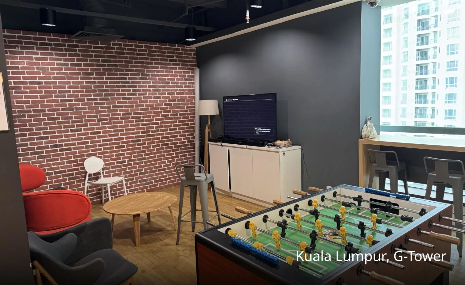 Foosball game at TP’s KL Tower office in Kuala Lumpur, Malaysia.