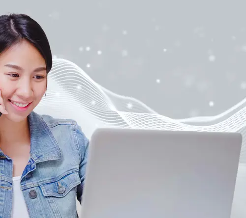 Smiling lady talks on phone while checking laptop amid digital sound waves.
