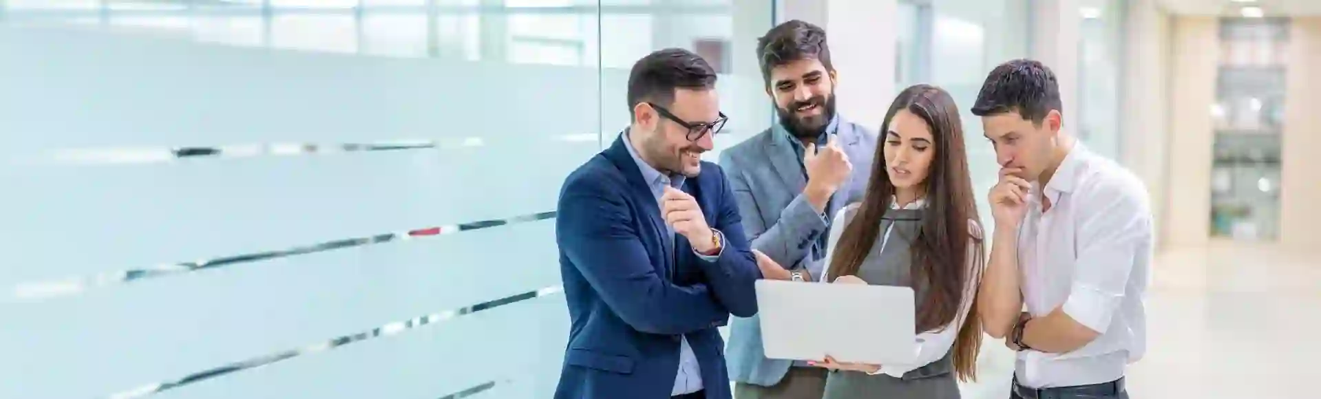 Team of employees collaborating in an office, representing late-stage debt recovery strategies.