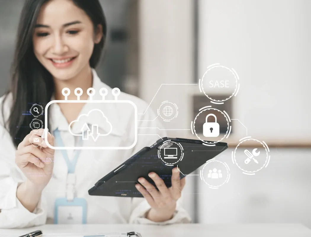 A woman have a notebook computer  in her hand and smiled,  dressed in a suit.