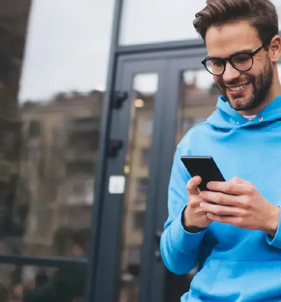 Man looking something in a smartphone