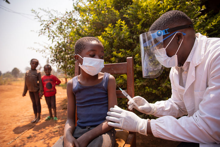 A child getting vaccinated in a humanitarian mission