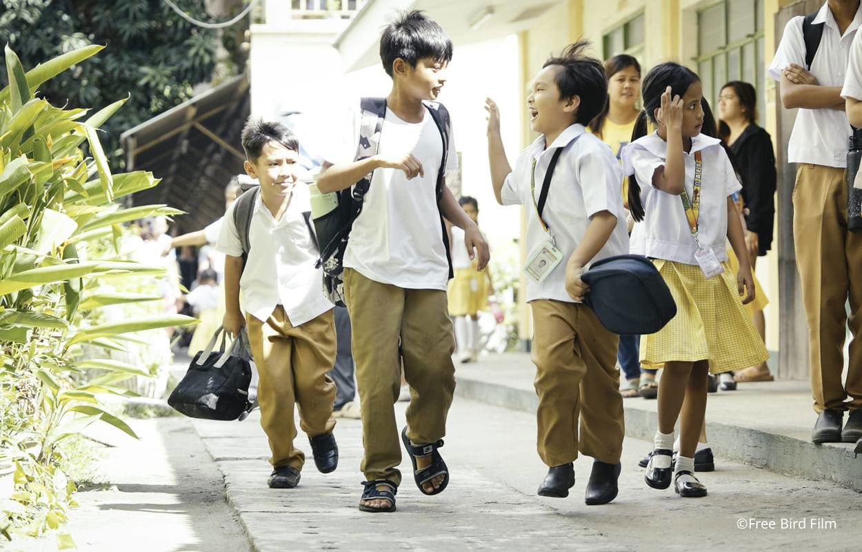 Two smiling boys having fun together in the Philippines, illustrating TP’s partnership with UNICEF.