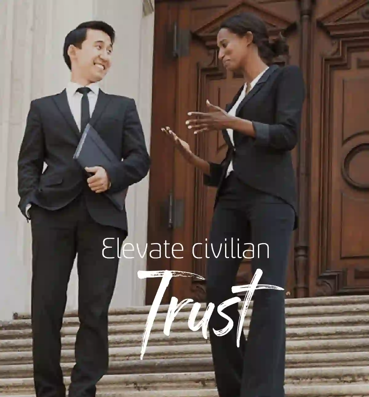 Business couple walking down the stairs
