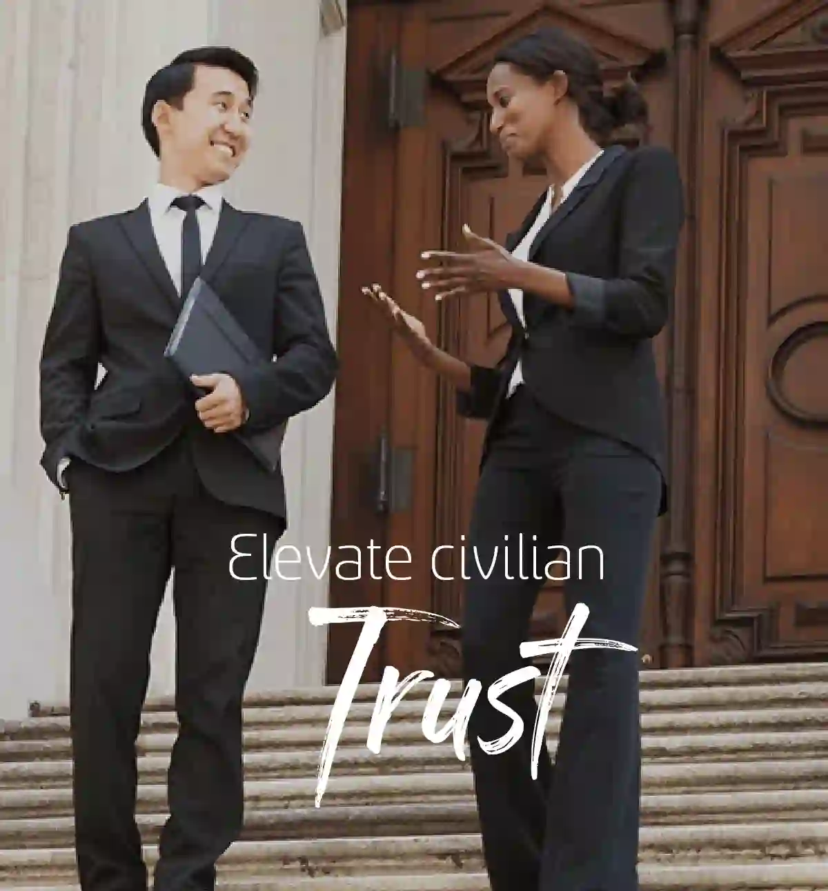 Business couple walking down the stairs