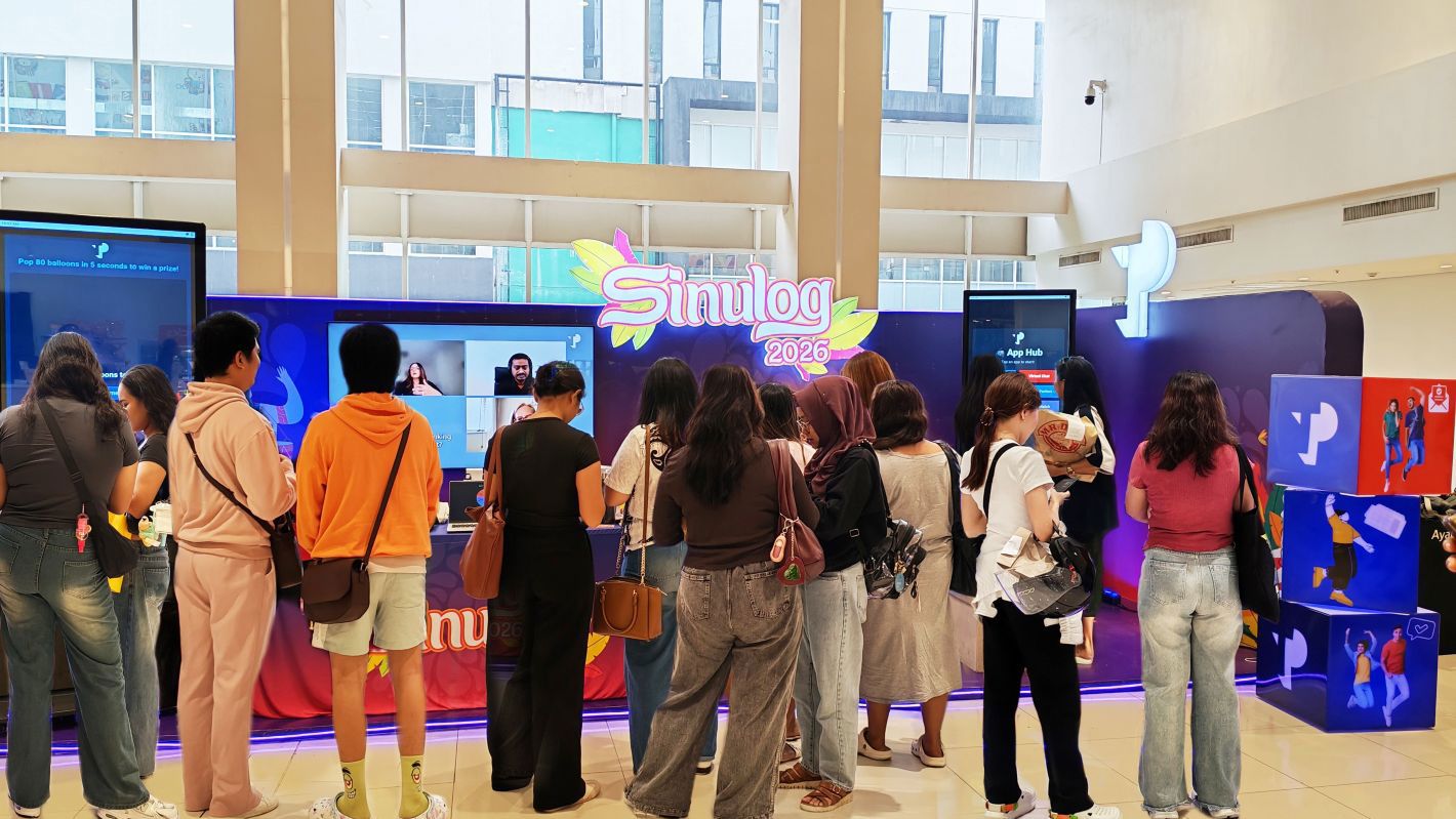 TP booth engaging visitors at Sinulog 2026 event with interactive digital displays.