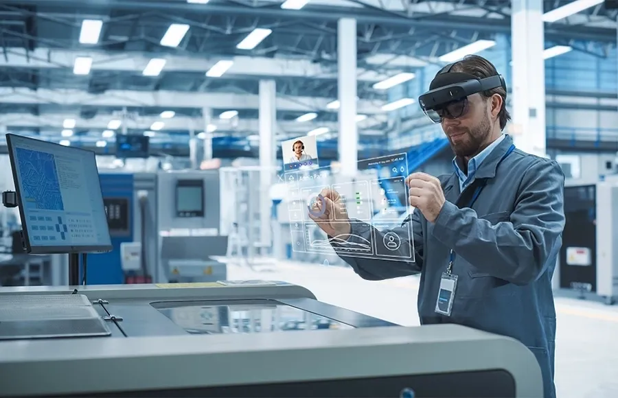 Engineer using AR interface to operate machinery in a high-tech manufacturing facility.