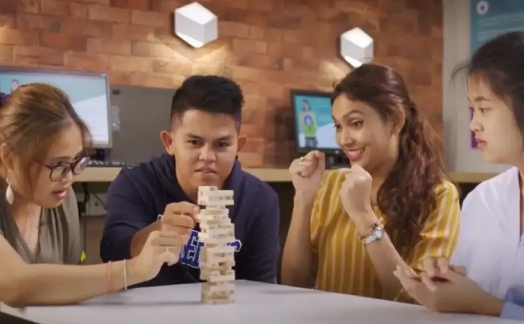 A bright, modern office interior featuring floor-to-ceiling windows offering a stunning panoramic view of the city skyline.