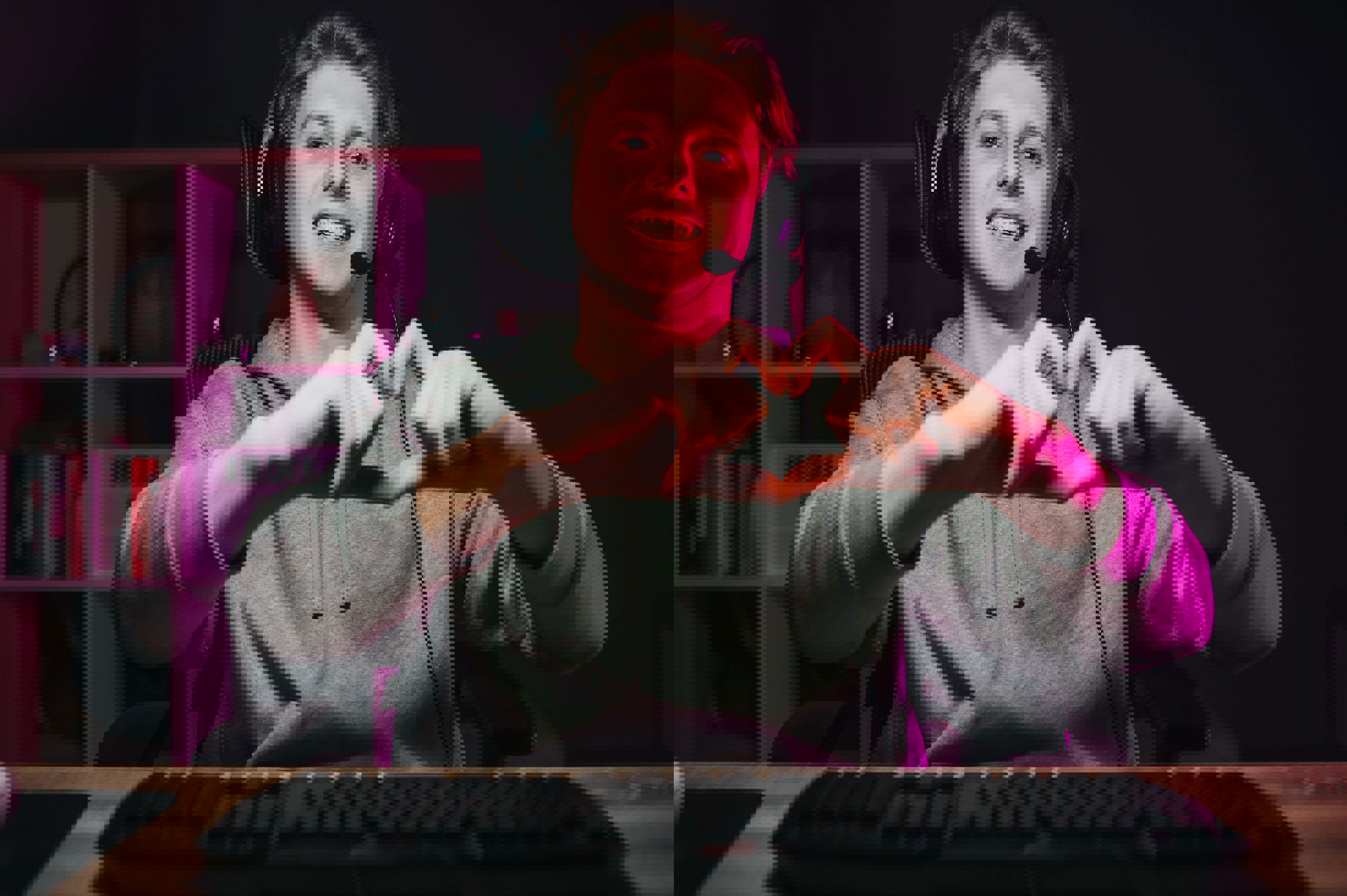 TP Russia employee working from home, wearing a headset and making a heart gesture with his hands in front of his computer.