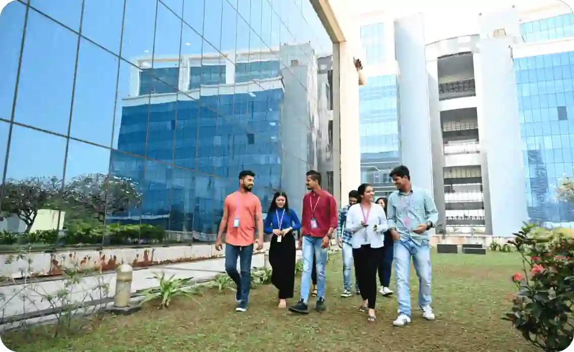 Group of TP employees walking outside TP building 