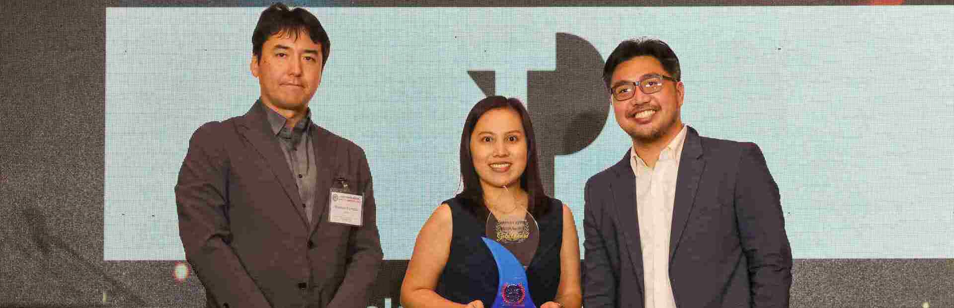 Rechelle Facun (center) and Marketing Manager Adrian Elumba (right) proudly represent TP at the Gold Award for Community Support and Engagement at the inaugural American Chamber of Commerce of the Philippines
