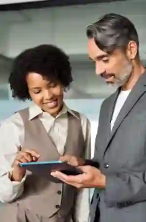 Couple working on a tablet at the office